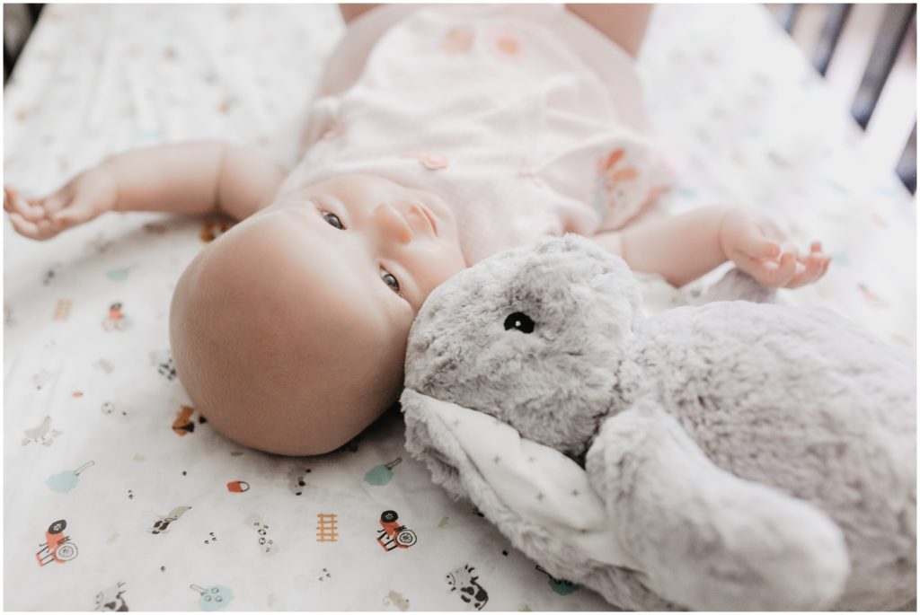 baby girl and her stuffed rabbit