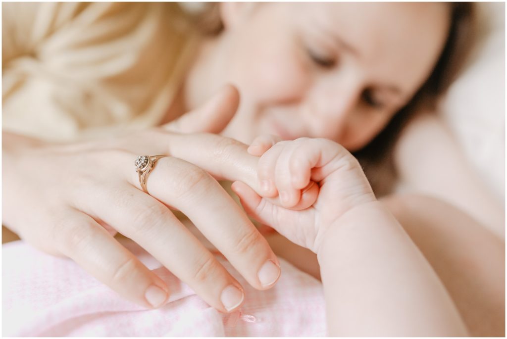 baby girl holding mom's hand photo by Alexandra Robyn Photo Design