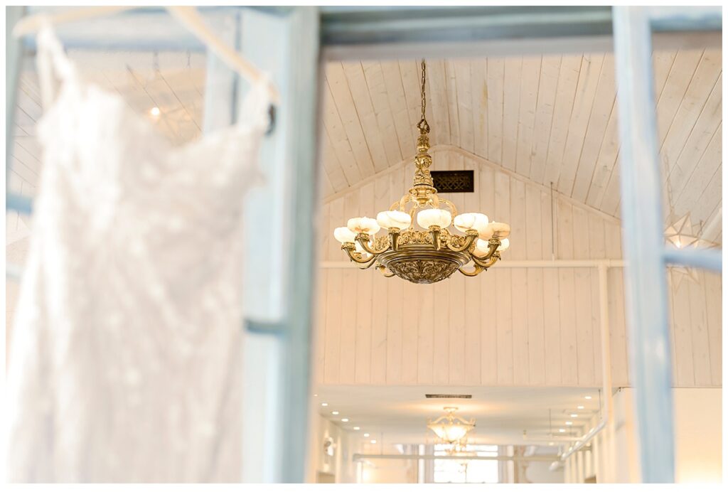 Wedding dress hangs in the getting ready space at Bavaria Downs in Chaska, MN. 